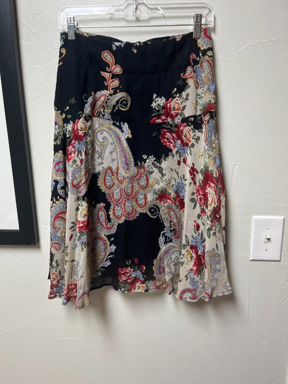 Flowy multi colored lined skirt. Just below knee length.